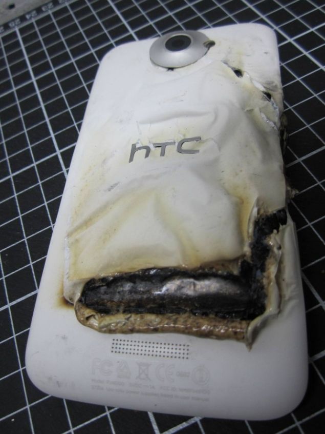 The fully damaged HTC One X after it has burs into flames during charging